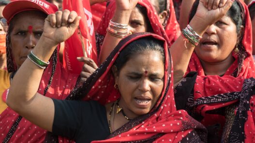 Female farmers of Maharashtra state take part in a rally to support protesting farmers against the central government's recent agricultural reforms at Azad Maidan.