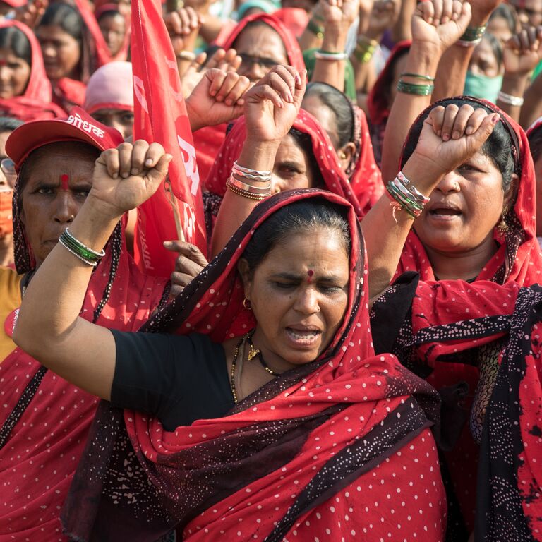 Female farmers of Maharashtra state take part in a rally to support protesting farmers against the central government's recent agricultural reforms at Azad Maidan.